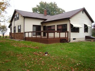 Country home with asphalt drive on nearly 12 acres with woods and outbuildings.  1-1/2 Story remodeled farm home with 3 bedrooms, 2 baths, eat-in kitchen w/custom hickory cabinets (J. Miller) and all appliances including washer and dryer.

Spacious living/dining room, full concrete block basement, covered front porch, rear deck and extra deep 2-car garage.

Quiet location convenient to town. - Country Home on 3.5 Acres